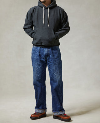 Black pullover hoodie with hood, white drawstrings, and kangaroo pocket