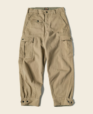 Khaki relaxed fit field pants with cargo pockets and button-front closure.