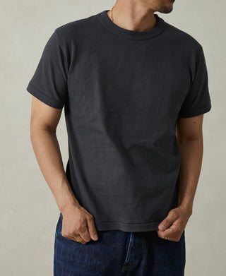 Men's vintage black crew-neck athletic T-shirt, front view with straight hem