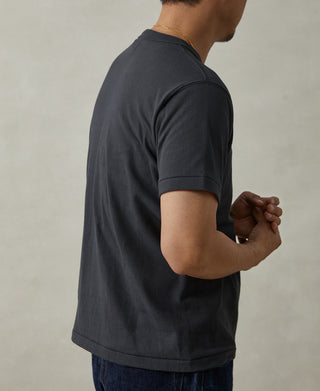 Men's vintage black crew-neck athletic T-shirt with short sleeves, side view