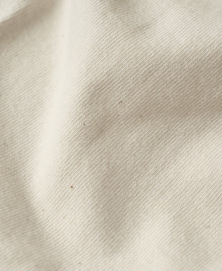 Apricot tubular athletic T-shirt knit texture close-up, breathable jersey weave