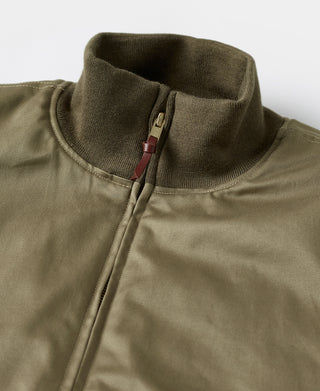 Olive green tanker jacket collar with ribbed trim and zip pull