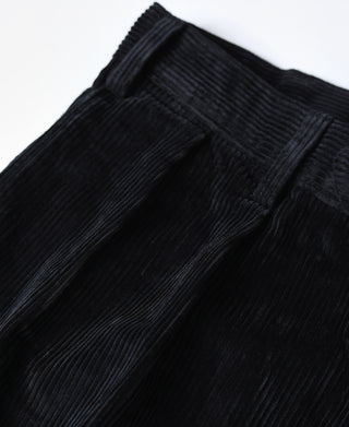 Black corduroy trousers with belt loops and pleated waistband seam