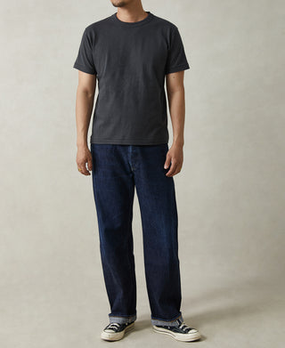 Men's vintage black crew-neck athletic T-shirt on model, full front view