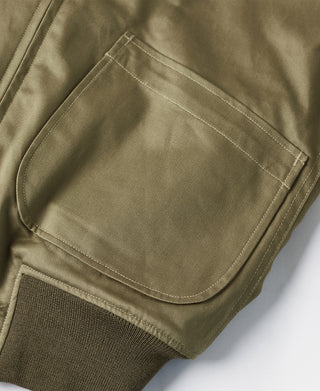 US Army yellow-green tanker jacket with side pocket and stitched trim