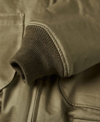 Olive green tanker jacket ribbed cuff with stitched pocket edge detail
