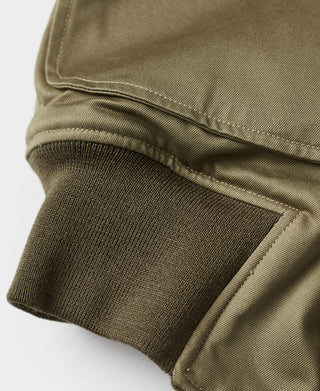 US Army yellow-green tanker jacket with knit cuff and stitched hem