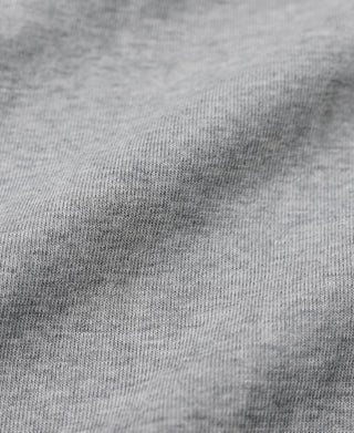 Gray knit fabric close-up on long-sleeve henley shirt sleeve