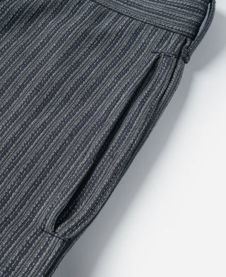 Black and gray striped pants with side seam and curved pocket opening
