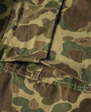 Camouflage cargo pants hem with stitched seam and fabric fold detail