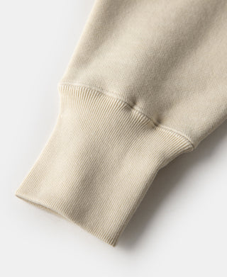 Cream ribbed sleeve cuff on a ski sweatshirt