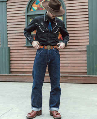 Black western shirt featuring white embroidered yoke and arrow accents