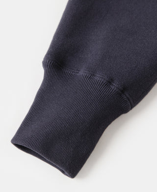 Navy ribbed knit sleeve cuff and hem on V-inset ski sweater