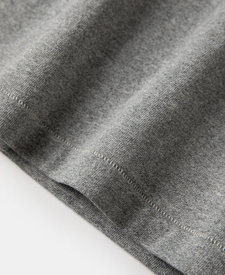 Gray athletic T-shirt knit fabric close-up, stitched hem edge