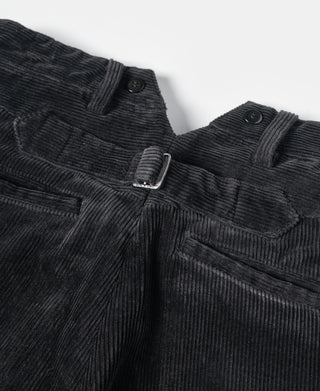 Black corduroy work pants front view with belt loops, button, and pleat lines.