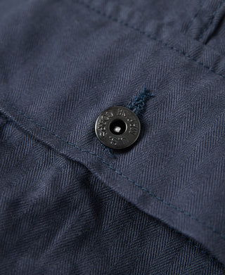 Navy utility shorts with metal snap button and textured woven fabric