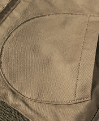 Khaki deck jacket chest pocket with curved flap and topstitching