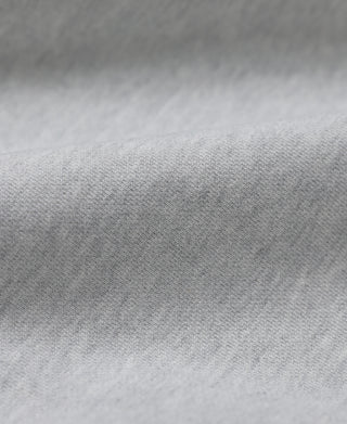 Gray hoodie fabric close-up with textured knit