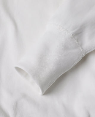 White henley shirt sleeve cuff with clean stitched edge
