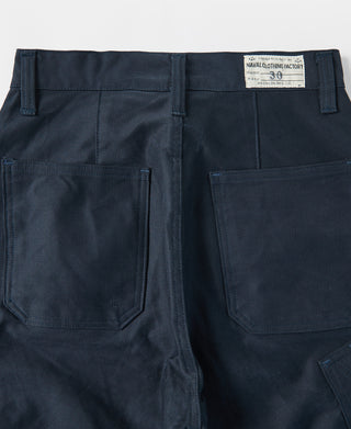 Navy deck pants back view close-up with large pockets and woven size label.