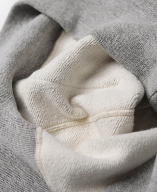 Gray terry hooded sweatshirt with ribbed hood edge, drawstring, and front pocket