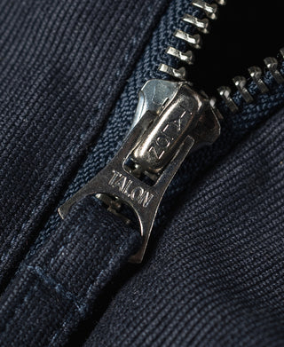 Navy deck jacket zipper and metal pull tab on textured front placket