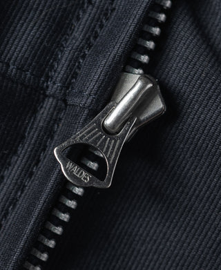 Navy deck jacket collar hardware buckle with "WALDES" tab close-up