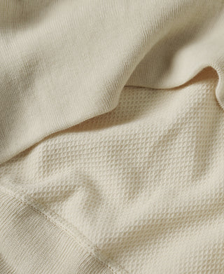 Light apricot waffle-knit T-shirt pocket opening and fabric fold