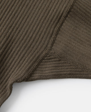 Close-up of olive-brown ribbed knit fabric on a long-sleeve henley
