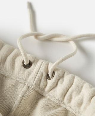Apricot drawstring waistband with metal eyelets on sweatpants