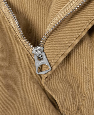 Tan trousers with zipper fly and stitched front placket detail