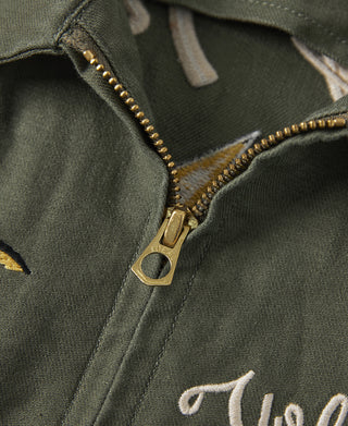 Olive fabric jacket with gold-tone zipper and embroidered collar trim