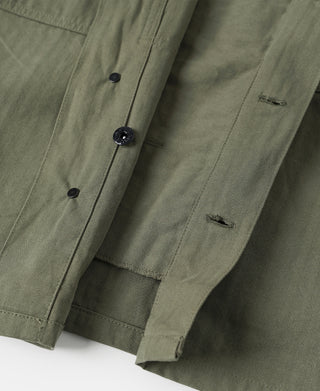 Olive jacket interior with lining and rows of hidden snap fasteners