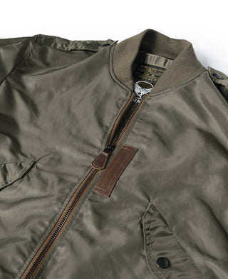 Olive flight jacket with stand collar, front zipper, and brown leather chest patch