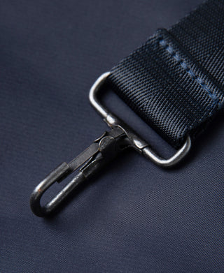 Navy helmet bag zipper pull with metal slider detail
