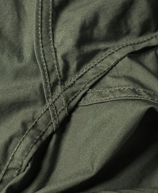 Olive M-65 parka stitched corner seam with interior pocket edge