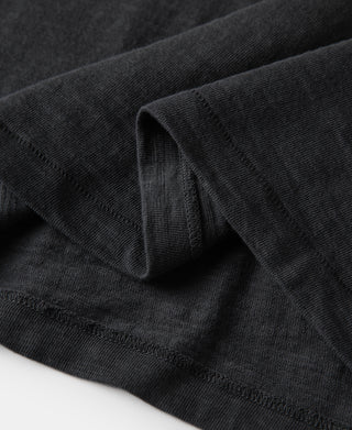 Loopwheel tubular henley T-shirt in black with cuff and fabric texture close-up