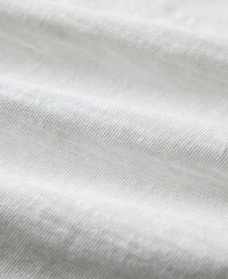 Close-up of white cotton t-shirt fabric texture