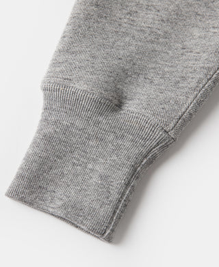 Gray ribbed sleeve cuff with knit texture close-up