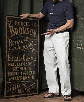 Navy henley T-shirt with three-button placket on model