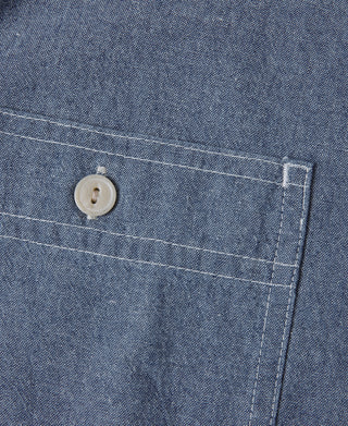Blue chambray work shirt inside placket with button and topstitching