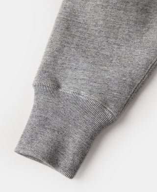 Gray knit sweater cuff with ribbed hem and sleeve end detail