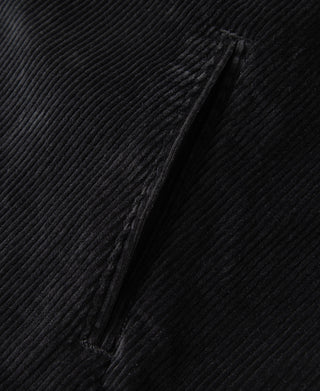 Black corduroy jacket front seam detail with textured wale pattern