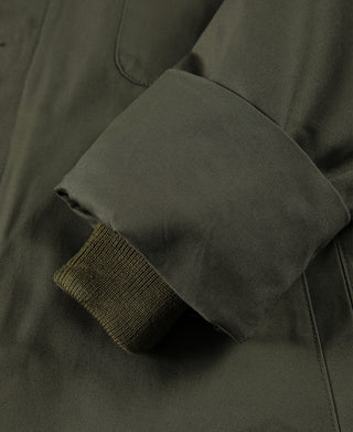Olive jacket sleeve hem with ribbed knit band and folded cuff