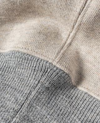Oatmeal fleece sweatshirt shoulder seam with gray ribbed collar trim