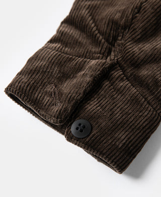 Brown corduroy cossack jacket cuff with round button closure