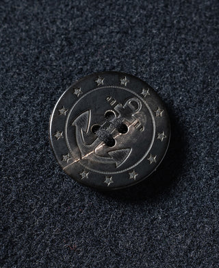 Navy peacoat close-up of round emblem button