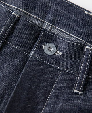 Indigo button closure at waistband with belt loops and pocket opening