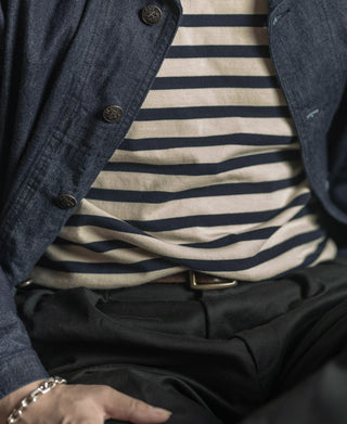 Apricot and navy striped long sleeve T-shirt worn under a jacket