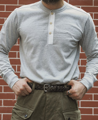Gray long-sleeve henley top with vertical button placket and henley collar